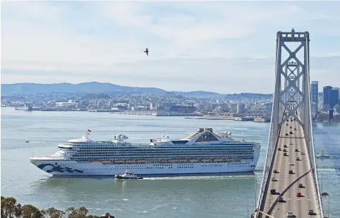  ?? (Jose Carlos Fajardo/Bay Area News Group/TNS) ?? THE ‘GRAND PRINCESS’ sails past the San Francisco-Oakland Bay Bridge on Yerba Buena Island last month.