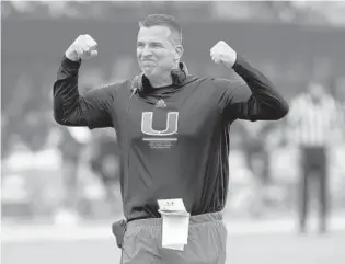  ?? ?? Miami coach Mario Cristobal reacts to fans during Saturday’s spring game.