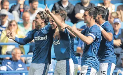  ?? Picture: PA. ?? Rangers’ Josh Windass, left, and team-mates celebrate his opening goal.