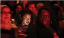  ??  ?? Audience member looks toward the stage during the She the People Presidenti­al Forum in Houston. Photograph: Loren Elliott/Reuters