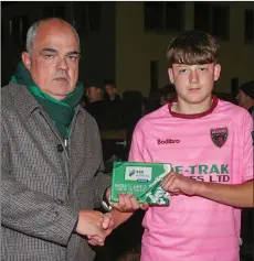  ??  ?? Morgan Ellis receives the player of the match award from Pat Duffy.