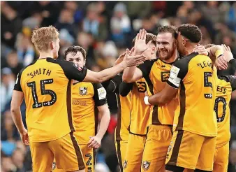  ?? ?? Tom Pope celebrates his goal in the FA Cup encounter at Manchester City.