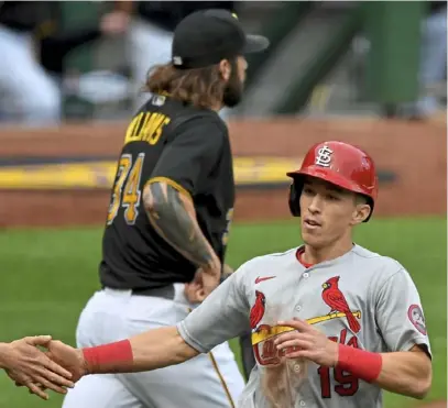  ?? Matt Freed/ Post- Gazette ?? The Cardinals’ Tommy Edman scores in front of Pirates starter Trevor Williams in the third inning of the first game of Friday’s doublehead­er at PNC Park.