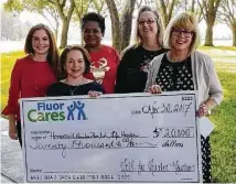  ??  ?? Front, from left, are Tracy Mooney from Fluor and Bette Moser, HomeAid Houston; from left, second row, are April Nemec, Barbara Jones and Rebecca Schoenherr from Fluor, presenting the check.