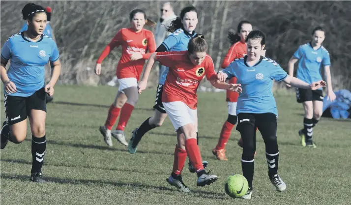  ??  ?? Lyons FC Under-12s (red) in action against Chester-le-Street Amazon Warriors.