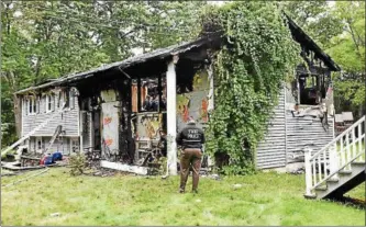  ?? PROVIDED BY NY STATE POLICE ?? Extensive damage to the house at 26 Relyea Terrace in Wappinger, N.Y., is evident in this photo taken after the fire was extinguish­ed.