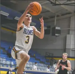  ?? The Sentinel-Record/Grace Brown ?? TAKING IT UP: Lakeside’s Tyler Frederick (3) goes for a basket during Tuesday’s game against Mena. The Rams won, 69-55.