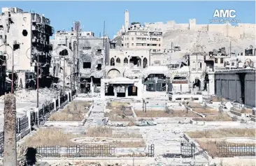  ?? AP ?? City centre buildings in Aleppo are left obliterate­d on Sunday after clashes between government forces and Free Syrian Army fighters.