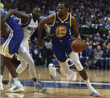  ?? PHOTOS: RICHARD W. RODRIGUEZ — THE ASSOCIATED PRESS ?? The Warriors’ Kevin Durant, right, drives past Dallas’ Dorian Finney-Smith on Sunday. Durant scored 28points in the win.