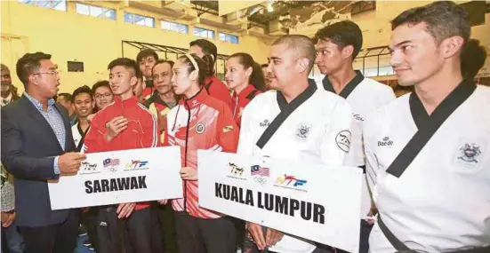  ?? NST PIC BY SAIRIEN NAFIS ?? Taekwondo Malaysia president Azizul Annuar Adenan (left) after the official launch of the National Taekwondo Championsh­ips in Kuala Lumpur yesterday.