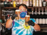  ??  ?? Bartender Melise Rodriguez says as long as people are careful and follow safety guidelines they should be fine.