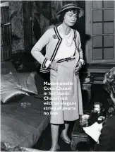  ??  ?? Mademoisel­le Coco Chanel in her iconic Chanel suit with an elegant string of pearls no less