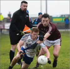  ??  ?? Dominic Ó Súilleabha­in of Dromid and Darragh O’Sullivan of Saint Marys scramble for the ball under the close eye of the linesman in the South Kerry SFC Final Photo by Stephen Kelleghan