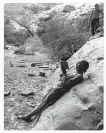  ?? COURTESY OF THE GEORGIA O’KEEFFE MUSEUM ?? “Georgia O’Keeffe Sketching in Glen Canyon,” 1961, gelatin silver print by Todd Webb.