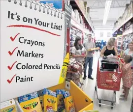  ?? Danny Johnston Associated Press ?? SHOPPERS at a Staples store in Arkansas in 2010. For many youngsters and their parents, store visits are as important as the convenienc­e of e-commerce.