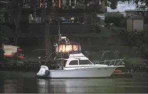  ?? Christian Abraham / Hearst Connecticu­t Media ?? Boats are docked at a home along the Housatonic River in on Friday . A rare tropical storm named Fay started Friday evening hitting the area with winds from 35-45 mph and gusts up to 50 mph.