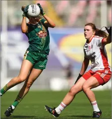  ??  ?? Meath’s Sarah Wall collects possession, watched by Niamh O’Neill.