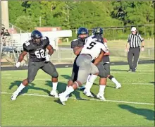  ??  ?? Seniors Deacon Allen and Jourdan Rachel stand firm on the offensive line during the latest scrimmage win over Temple.