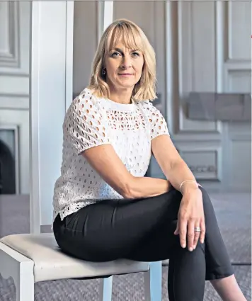  ??  ?? Time to talk: Louise Minchin, the BBC Breakfast host, says the menopause snuck up on her. Below, on the sofa with Dan Walker