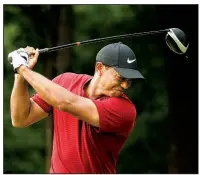  ?? AP/CHARLIE RIEDEL ?? Tiger Woods reacts to his drive on the 17th hole during the final round of the PGA Championsh­ip on Sunday at Bellerive Country Club in St. Louis. Woods pushed his tee shot right of the creek running along the right side of the hole.