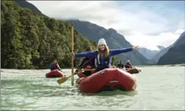  ?? NEW ZEALAND VIA AP ?? Bryce Dallas Howard enjoys a kayak trip down the Dart River in New Zealand. Howard says her enthusiasm for New Zealand hasn’t dimmed since she first visited at age 5.