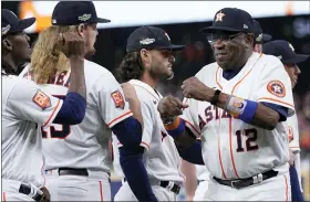  ?? AP PHOTO/KEVIN M. COX ?? Houston Astros manager Dusty Baker Jr. greets players ahead of Game 1of baseball’s American League Championsh­ip Series between the Houston Astros and the New York Yankees, Wednesday, Oct. 19, 2022, in Houston.