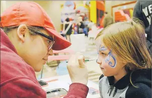  ?? MITCH MACDONALD/THE GUARDIAN ?? Mara Duncan, 5, gets her face painted by Bridgette Casford of Par-T-Perfect at the remote broadcast site for the IWK Telethon for Children in Charlottet­own. Duncan, a Stratford resident, celebrates at the Charlottet­own telethon site almost every year...