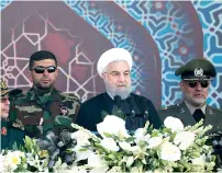  ?? AP ?? Iran’s President Hassan Rouhani speaks at a military parade marking the 37th anniversar­y of Iraq’s 1980 invasion of Iran, outside Tehran on Friday. —