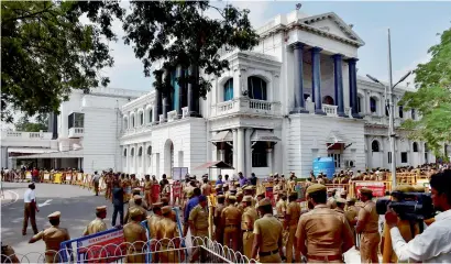  ??  ?? Police personnel standing outside the Tamil Nadu Secretaria­t in Chennai on Saturday. —