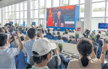  ?? AFP ?? Journalist­s watch China’s President Xi Jinping delivering a speech during the opening of the Boao Forum for Asia (BFA) Annual Conference 2021 in Boao, Hainan province yesterday.