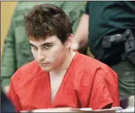  ?? TAIMY ALVAREZ/SUN SENTINEL ?? Florida school shooting suspect Nikolas Cruz quickly glances up at the prosecutor­s while in court for a hearing to move forward the death penalty case on April 27 in Fort Lauderdale, Fla.