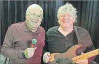  ?? 46#.*55&% 1)050 ?? Dino Dunsford, left, and Gary Chipman team up for a Pig & Whistle dance on July 13 at the New London Community Complex.