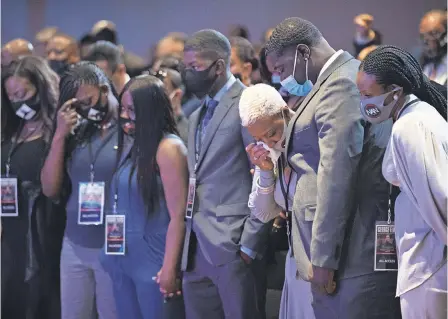  ??  ?? Members of George Floyd’s family stand in silence for 8 minutes and 46 seconds, the time police officers had him pinned to the ground. Thursday’s memorial in Minneapoli­s was the first of three services for Floyd. PHOTOS BY JACK GRUBER/ USA TODAY