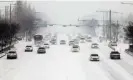  ?? Photograph: YONHAP/EPA ?? Cars move slowly on a road amid heavy snowfall in Gwangju, South Korea on Tuesday.