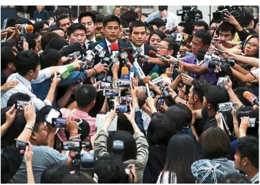  ?? — Reuters ?? Meeting the press: Preechapol and members of his party speaking to the media after hearing the verdict at the Constituti­onal Court in Bangkok.