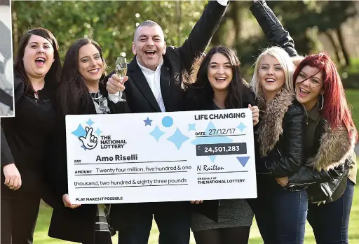  ??  ?? Over the moon: Amo Riselli, 50, celebrates his multi-million pound lottery win with his five daughters in Gloucester