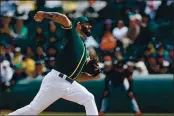  ?? RANDY VAZQUEZ — BAY AREA NEWS GROUP, FILE ?? The A’s Mike Fiers throws a pitch during his team’s Cactus League game versus the Giants at Hohokam Stadium in Mesa, Ariz., on Feb. 23.