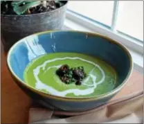  ?? PHOTO BY EMILY RYAN ?? EatNic’s spring pea soup features mint, morels and creme fraiche.