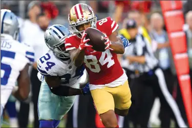  ?? JOSE CARLOS FAJARDO/TRIBUNE NEWS SERVICE ?? Above: The San Francsico 49ers' Kendrick Bourne (84) reaches for a pass while being defended by the Dallas Cowboys' Chidobe Awuzie during a preseason game in Santa Clara on Thursday. 49ers quarterbac­k Jimmy Garoppolo (10) looks to throw a pass against the Cowboys.