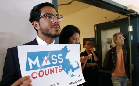  ?? HERALD STAFF FILE ?? SPREADING THE WORD: Sebastian Zapata, the city’s census liason, holds a sign during an event promoting the 2020 Census at the Vietnamese American Initiative for Developmen­t last August.