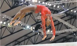  ?? VADIM GHIRDA/AP ?? Simone Biles earned the bronze medal on the balance beam Saturday and was 6-for-6 in medalling in every women’s event during the Gymnastics World Championsh­ips.