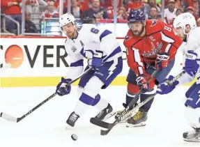  ?? GEOFF BURKE/USA TODAY SPORTS ?? The Capitals and Alex Ovechkin (8) battle the Lightning and Anton Stralman (6) on Wednesday to advance to the Stanley Cup Final.