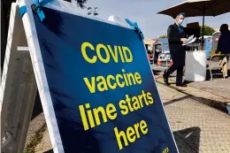  ?? HAVEN DALEY/AP ?? COVID-19 vaccinatio­ns offered in San Francisco. About 63% of all vaccine-eligible Americans — those 12 and older — have received at least one dose, according to the CDC.