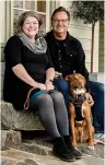  ?? (Eric Rewitzer via AP) ?? Husband and wife artist team Annie Galvin, left, and Eric Rewitzer pose with their dog Woody in front of their 3 Fish Studios art gallery in 2023 in Amador City, Calif. Galvin and Rewitzer moved out of San Francisco to live closer to nature after their sabbatical in France and Ireland.