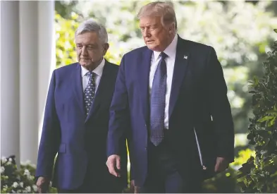  ?? AL DRAGO / BLOOMBERG FILES ?? Mexico’s President Andres Manuel Lopez Obrador and U.S. President Donald Trump arrive last Wednesday at the
USMCA signing ceremony outside the White House in Washington, D.C.