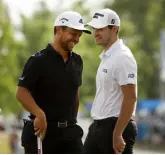  ?? Chris Graythen, Getty Images North America ?? Xander Schauffele, left, and Patrick Cantlay react after putting to win the Zurich Classic of New Orleans.