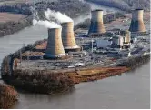  ?? Andrew Harrer / Bloomberg file ?? Cooling towers emit steam at Pennsylvan­ia’s Three Mile Island nuclear plant. Natural gas has a cost advantage over nuclear.