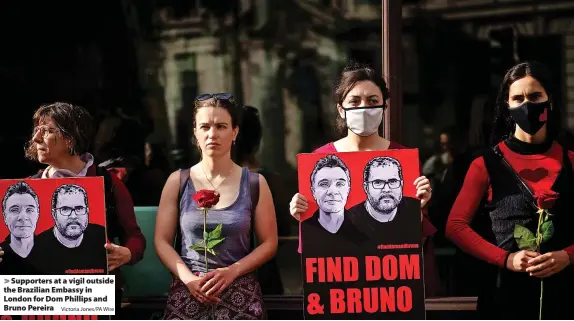  ?? Victoria Jones/PA Wire ?? Supporters at a vigil outside the Brazilian Embassy in London for Dom Phillips and Bruno Pereira