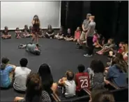  ?? SUBMITTED PHOTO ?? Students explore improvisat­ion during all three-summer camps at Steel River Playhouse, with camp director Phil Ballantine.