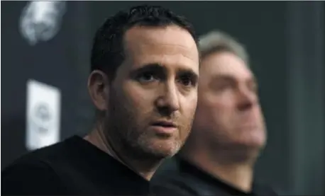  ?? JACQUELINE LARMA — THE ASSOCIATED PRESS ?? Howie Roseman, left, executive vice president of football operations for the Eagles, answers a reporter’s question alongside coach Doug Pederson during a news conference Tuesday.